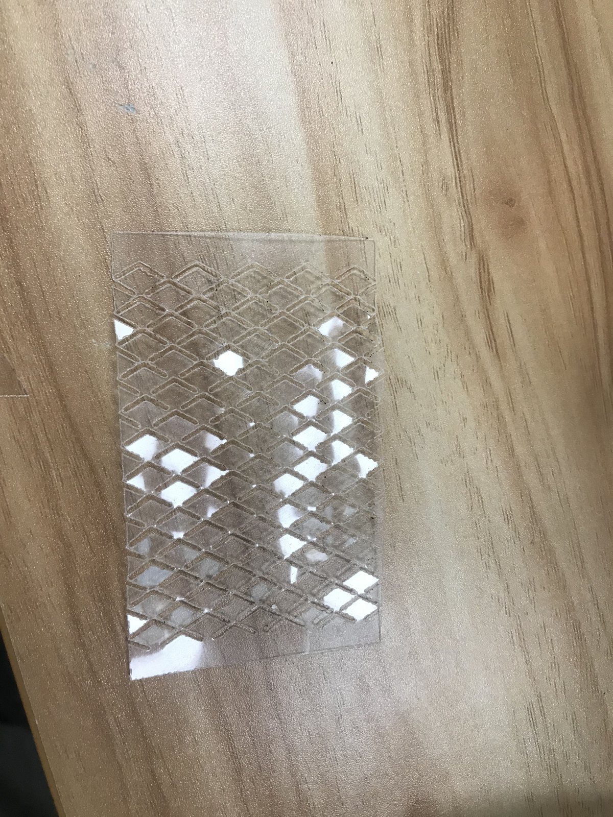 A transparent PET sheet opened along its cut pattern.